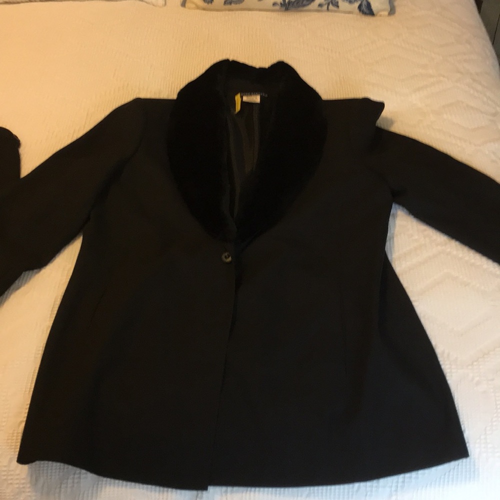 Women’s Black skirt suit.